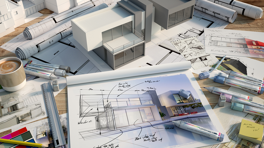 3D rendering of an architects desktop with a house mock up, markers, color swatches, layout block with house design and multiple drafts